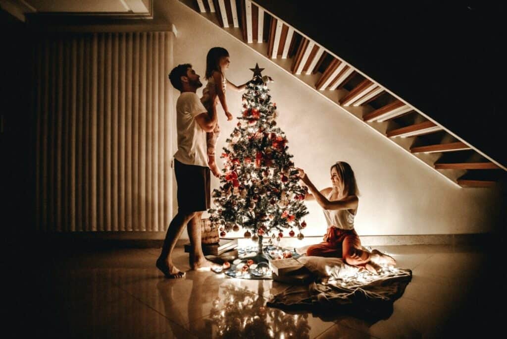 Family Arranging Christmas Tree