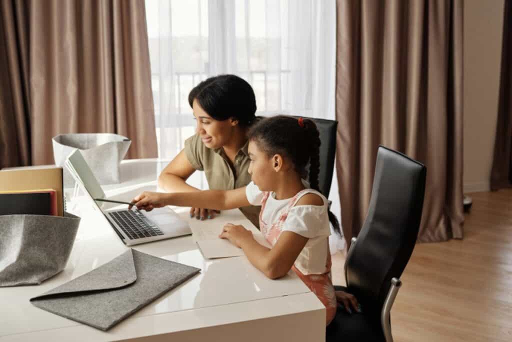 Mother Teaching Child How To Learn English Online